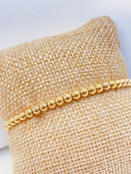 ZO3009 Pulsera Elastizada Bolitas 3mm Baño Oro