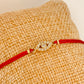 ZO3014 Pulsera Hilo Rojo Diferentes conectores Baño Oro