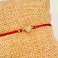 ZO3014 Pulsera Hilo Rojo Diferentes conectores Baño Oro